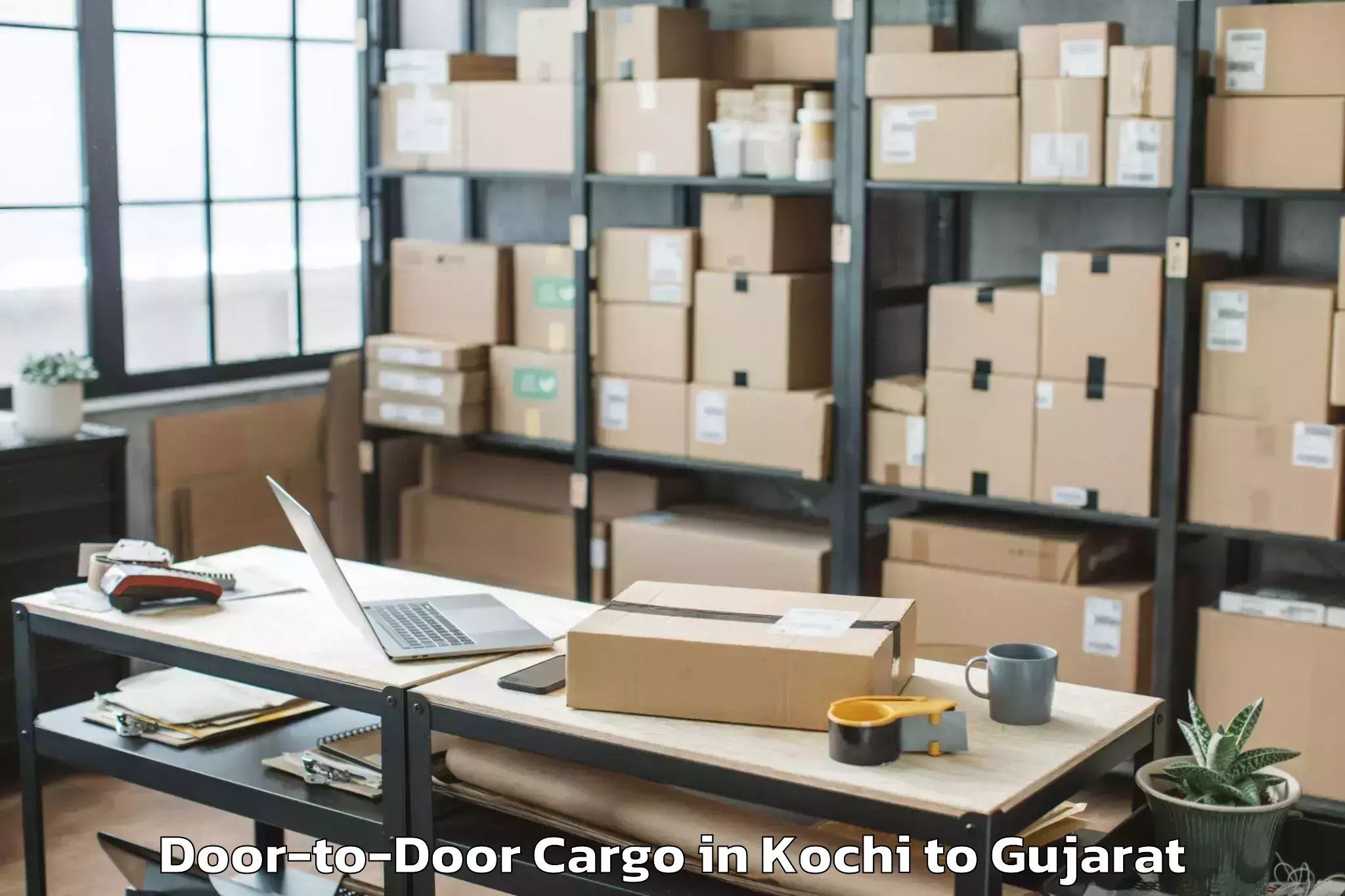 Leading Kochi to Kadi Sarva Vishwavidyalaya Gan Door To Door Cargo Provider